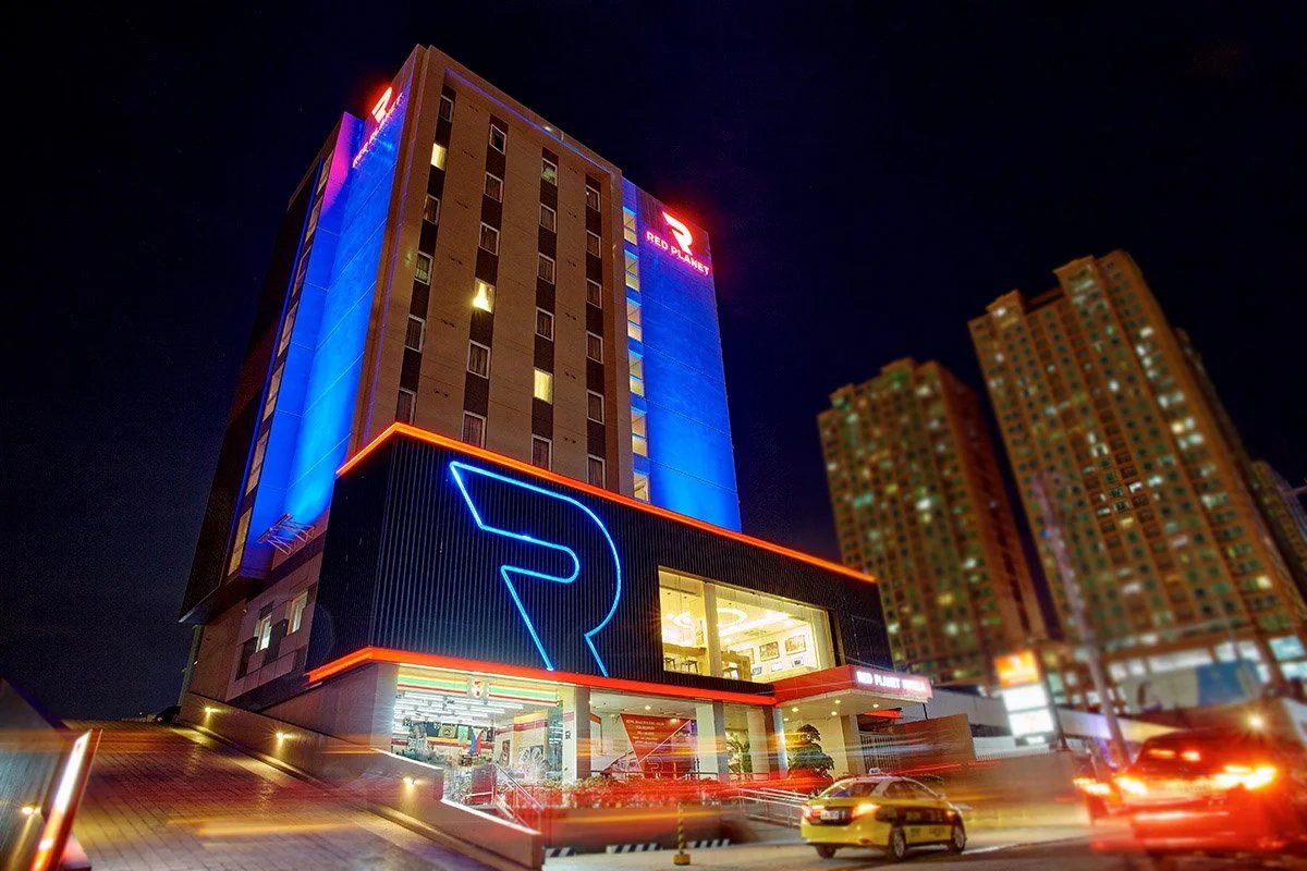 Red Planet Hotel exterior illuminated at night
